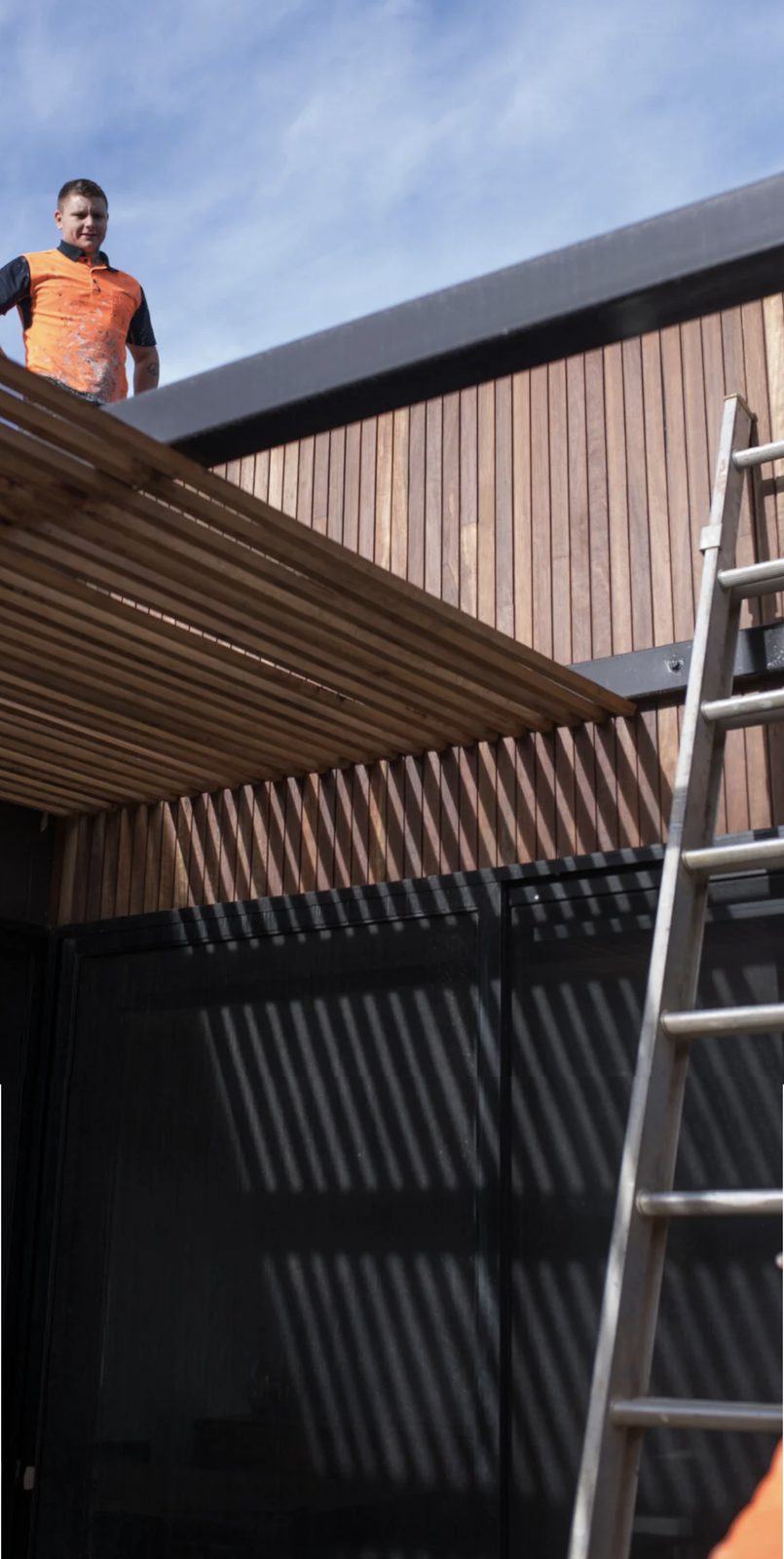 A Foodhaven fitter working on a retail shopfront installation.